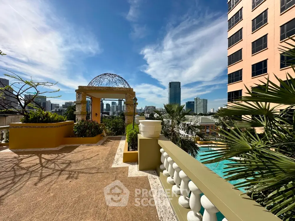 Luxurious rooftop terrace with stunning city views and elegant architectural details.