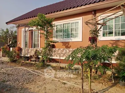 Charming single-story home with lush garden and modern windows.