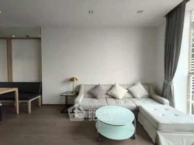Modern living room with stylish sofa and natural light