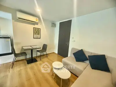 Modern living room with cozy sofa and dining area in stylish apartment.