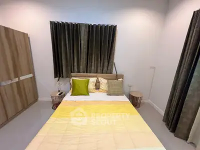 Cozy bedroom with modern decor and ample natural light