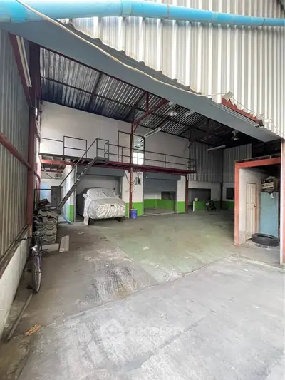Spacious industrial warehouse with mezzanine and ample storage space