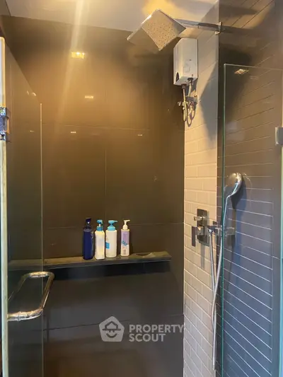 Modern bathroom shower with sleek glass door and stylish fixtures