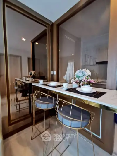 Stylish modern kitchen with elegant bar seating and floral decor
