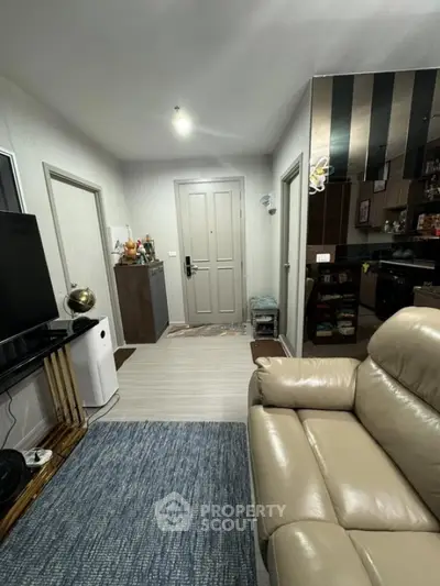 Cozy living room with modern decor and leather recliner