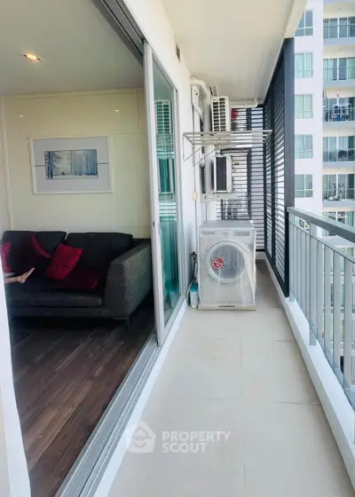 Modern balcony with sliding glass doors and cozy interior view