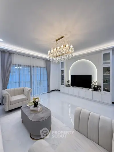 Luxurious living room with elegant chandelier and modern decor