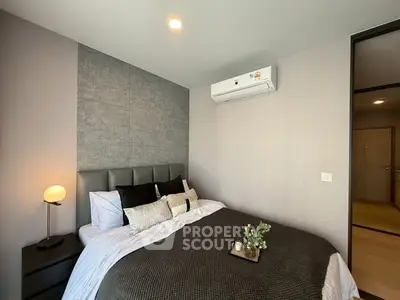 Modern bedroom with stylish decor and air conditioning unit
