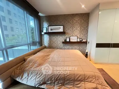 Luxurious bedroom with modern decor and large window view