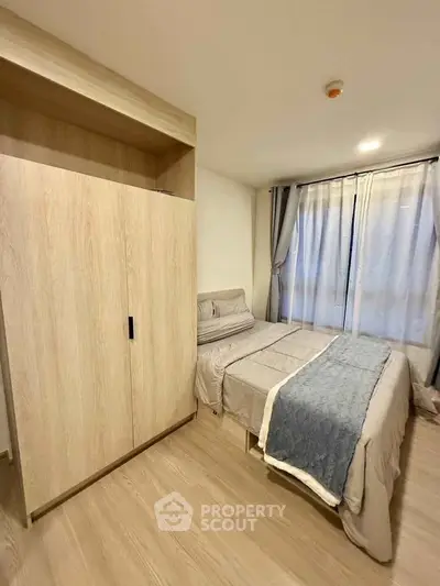 Cozy bedroom with modern wardrobe and natural light