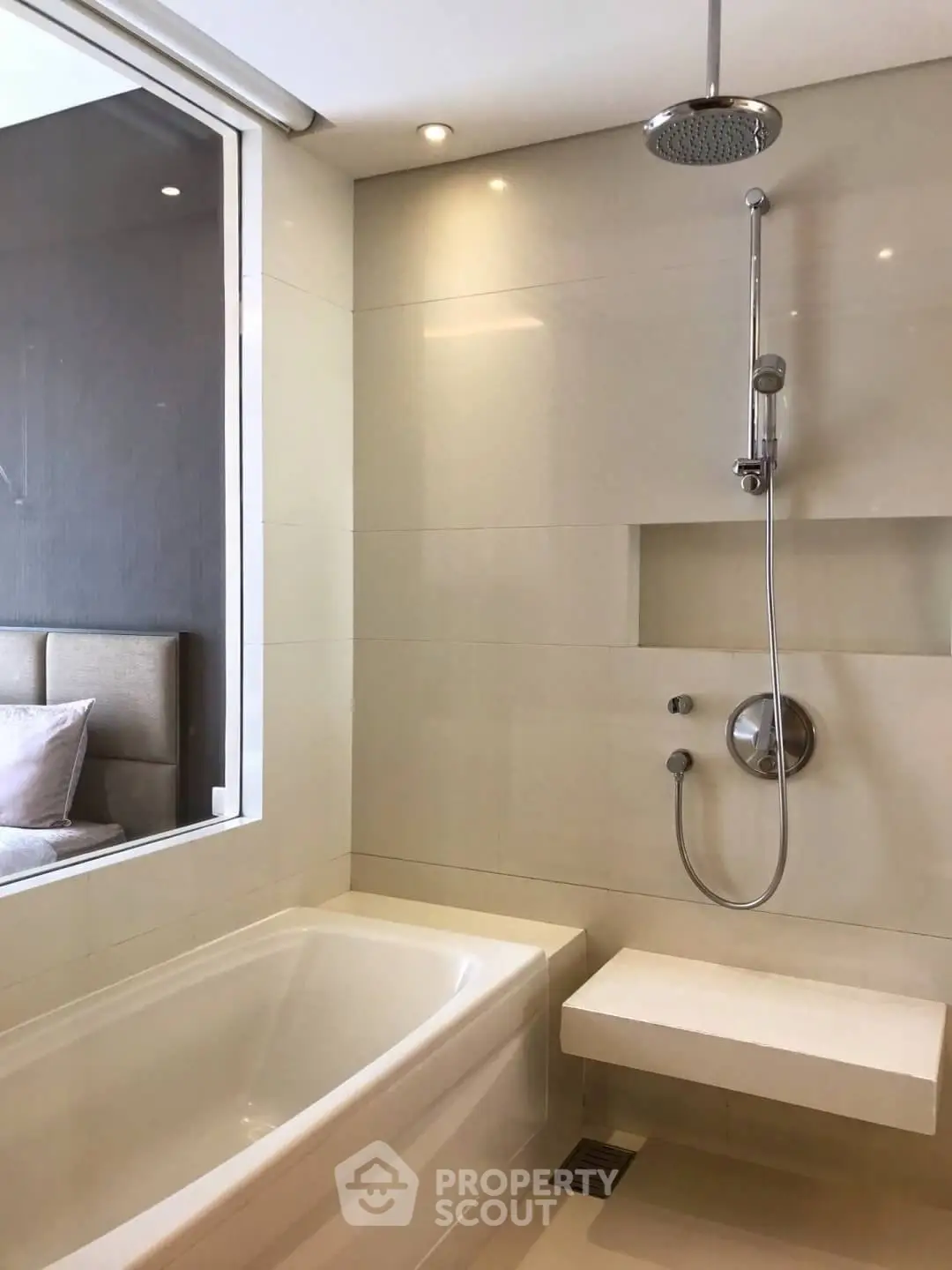 Modern bathroom with sleek shower and bathtub in luxury apartment