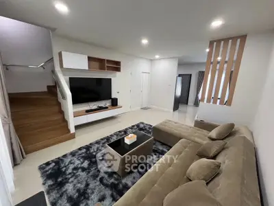 Modern living room with plush sectional sofa and sleek entertainment center