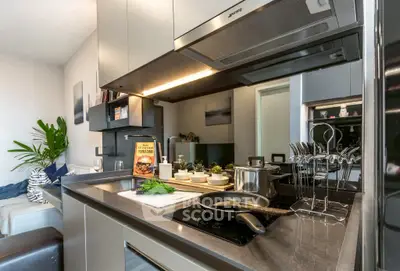Modern kitchen with sleek design, featuring induction cooktop and stylish cabinetry.