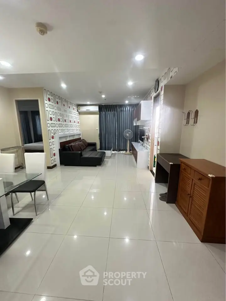Spacious modern living room with stylish decor and open layout, perfect for entertaining.