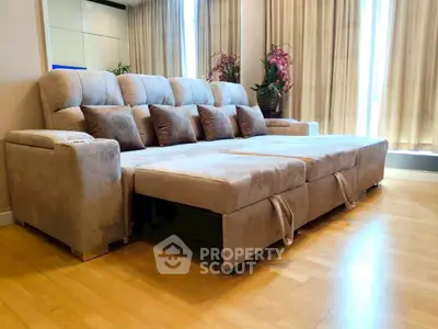 Spacious living room with plush sectional sofa and elegant decor