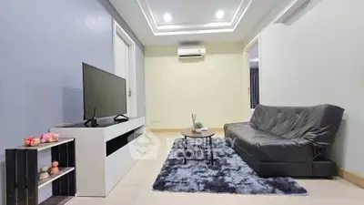 Modern living room with sleek furniture and stylish decor in a cozy apartment.