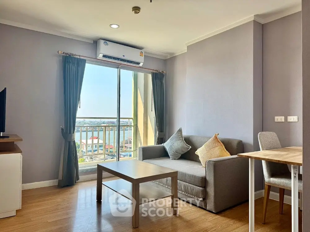 Bright living room with balcony view in modern apartment