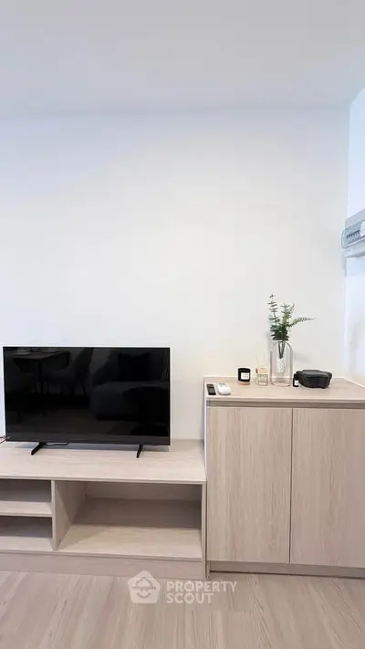 Modern living room with sleek TV stand and minimalist decor