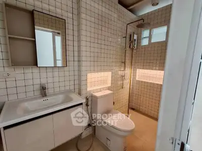 Modern bathroom with sleek fixtures and stylish tile design