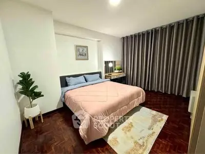 Spacious bedroom with elegant decor and cozy ambiance