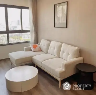 Modern living room with stylish sofa and city view window