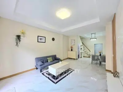 Spacious modern living room with elegant decor and open dining area