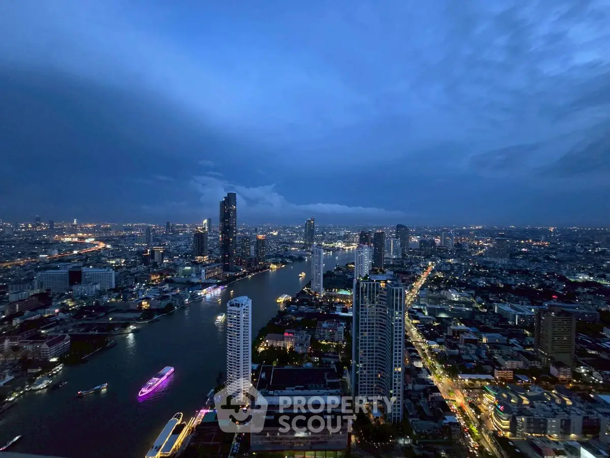 Stunning cityscape view with river and illuminated skyline at dusk, showcasing urban living.