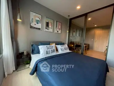 Modern bedroom with stylish decor and cozy bedding in a contemporary apartment.
