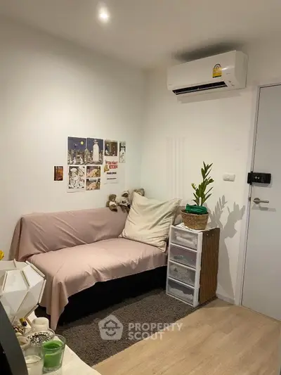 Cozy living room with air conditioning and stylish decor in modern apartment.