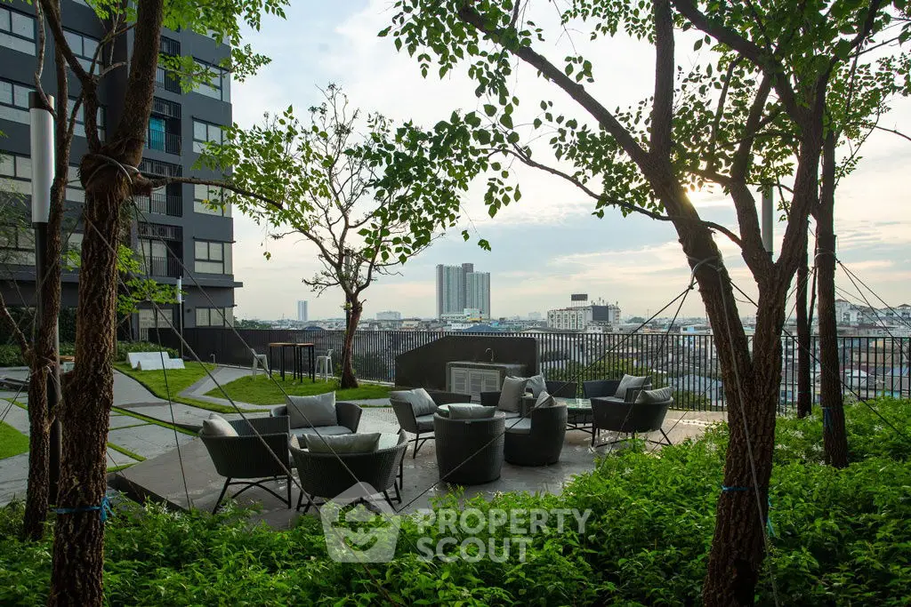 Stunning rooftop garden with modern seating and panoramic city views.
