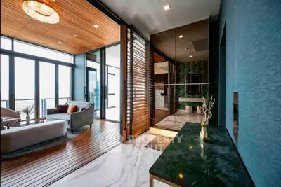 Luxurious modern living room with floor-to-ceiling windows and elegant decor
