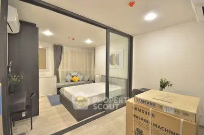 Modern bedroom with glass partition and washing machine box