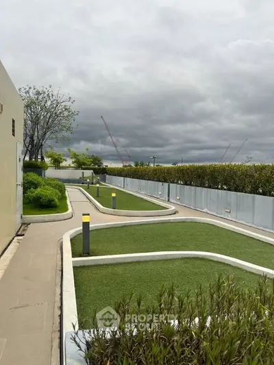 Modern rooftop garden with lush greenery and scenic views, perfect for relaxation and leisure activities.