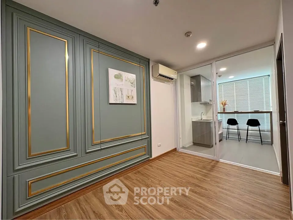 Modern interior with elegant wall paneling and open kitchen layout