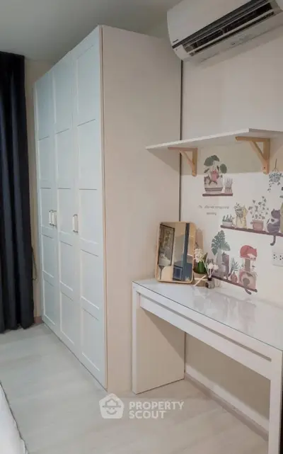 Charming bedroom with stylish wardrobe and cozy desk setup