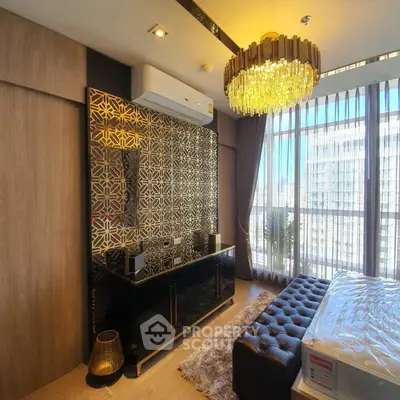 Luxurious bedroom with elegant chandelier and floor-to-ceiling windows