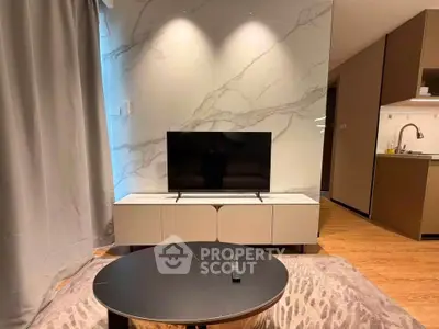 Modern living room with marble accent wall and sleek TV setup
