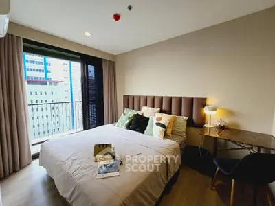 Modern bedroom with balcony view in a high-rise apartment, featuring stylish decor and natural light.
