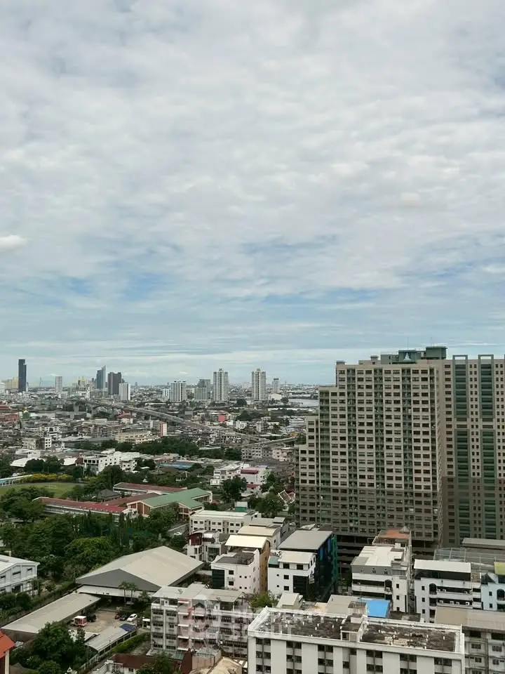 Stunning cityscape view from high-rise building showcasing urban skyline and residential architecture.