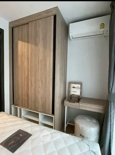 Modern bedroom with wooden wardrobe and compact study area