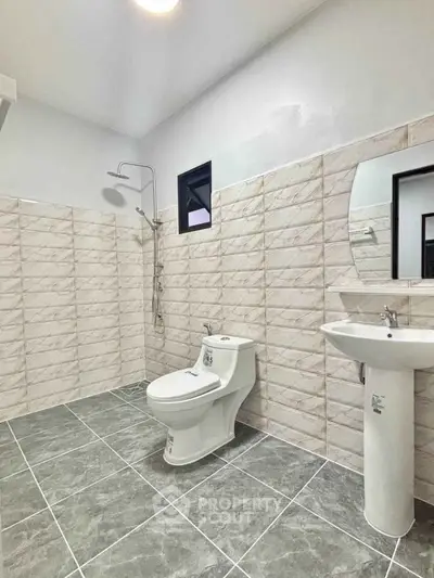 Modern bathroom with sleek tiles and contemporary fixtures
