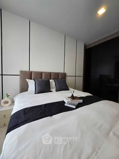 Luxurious modern bedroom with stylish decor and plush bedding