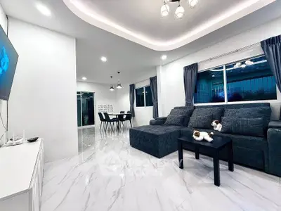 Modern living room with sleek marble flooring and stylish furniture