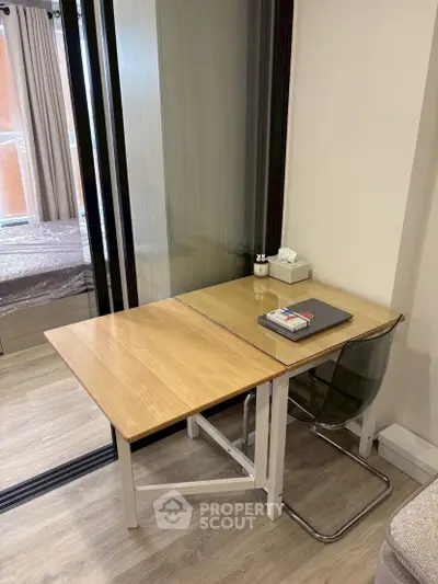 Modern study area with sleek desk and chair in a stylish apartment