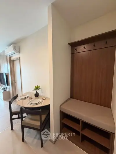 Modern apartment interior with dining area and stylish seating bench