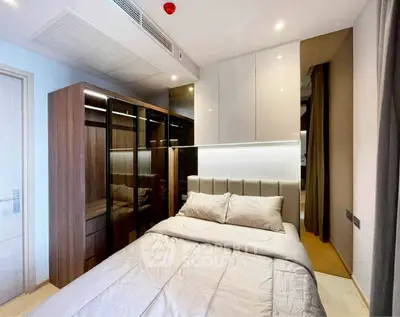 Modern bedroom with sleek design and ample closet space