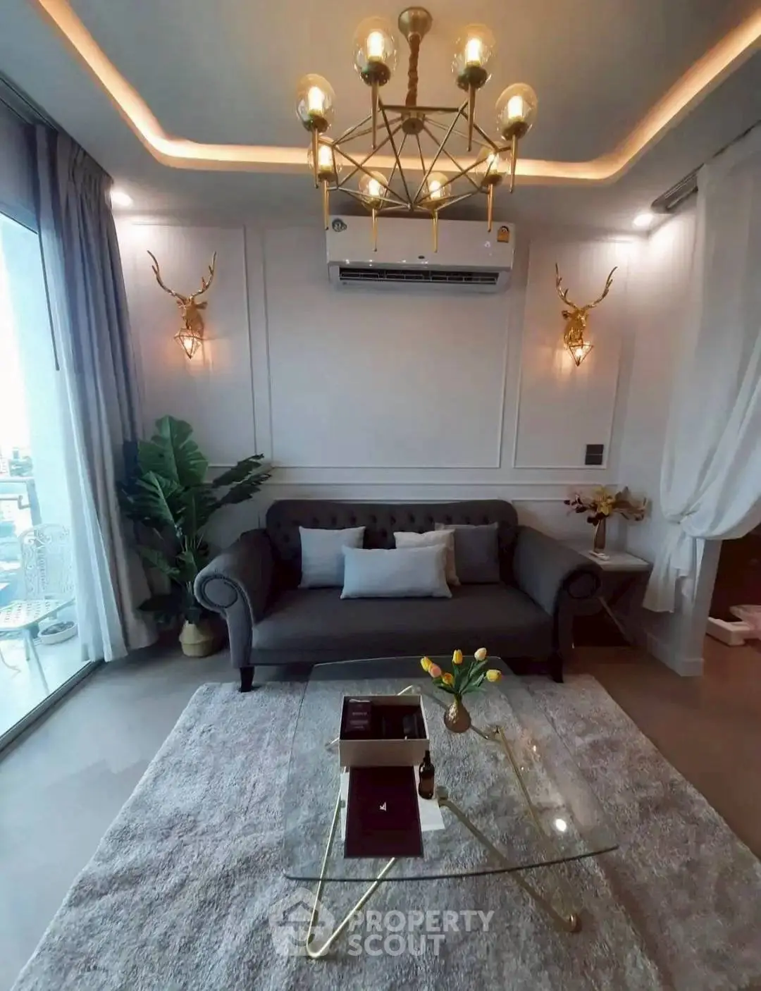 Luxurious living room with elegant chandelier and modern decor