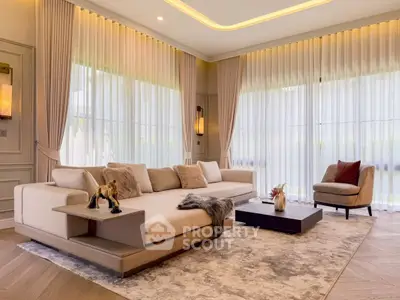 Luxurious living room with elegant decor and large windows