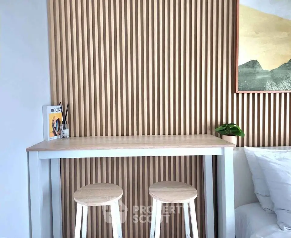 Modern minimalist interior with wooden slat wall and sleek furniture
