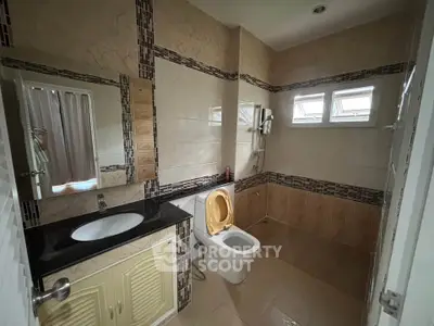 Spacious bathroom with modern fixtures and natural light